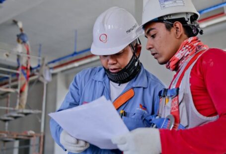 Safety - Two Man Holding White Paper