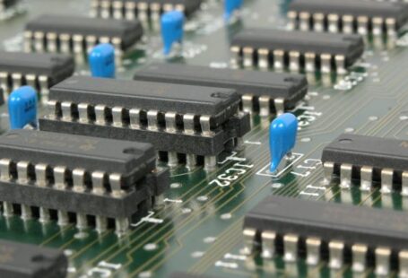 Integration - Black and Blue Electronic Tools on Green Circuit Board