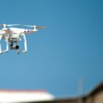 Robotics - Selective Focus Photograph of White Quadcopter Drone during Blue Hour