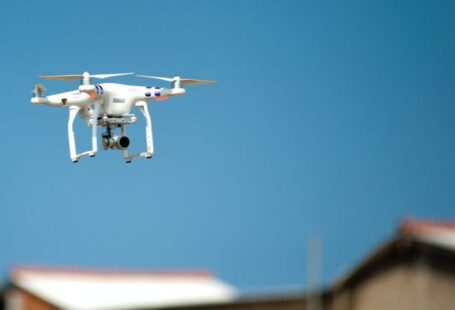 Robotics - Selective Focus Photograph of White Quadcopter Drone during Blue Hour