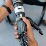 Robotic Exoskeletons - Person Holding Prosthetic Arm