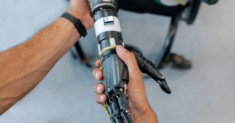 Robotic Exoskeletons - Person Holding Prosthetic Arm