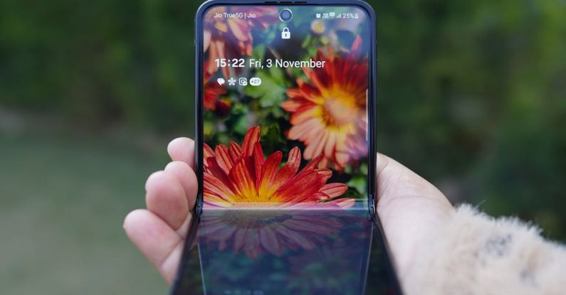 Foldable Phones - Hand with Foldable Smartphone