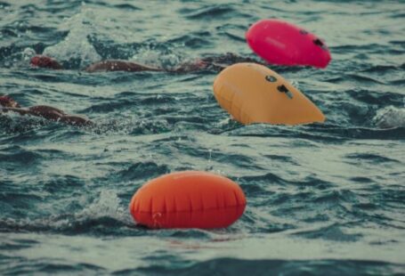 Security Features - Swimmers in the ocean with floating balls