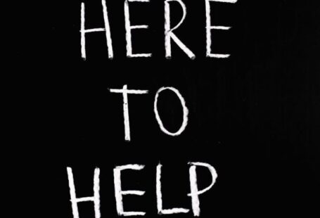 Benefits - Here To Help Lettering Text on Black Background