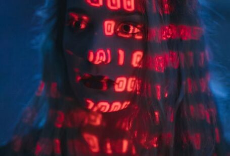 Cybersecurity Threats - Woman With Red Light On Face