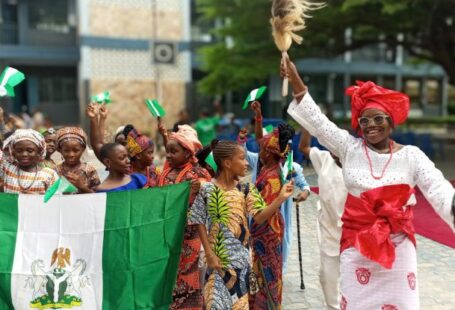 Decentralized Identity - A group of people holding flags and dancing