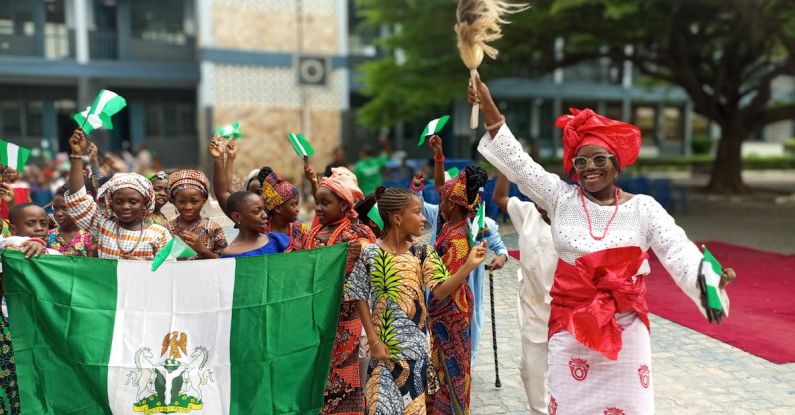 Decentralized Identity - A group of people holding flags and dancing
